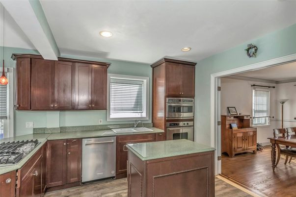 Dining room, Interior, Kitchen, Recessed Lighting, Stainless Steel Appliances, Wood Texture Flooring