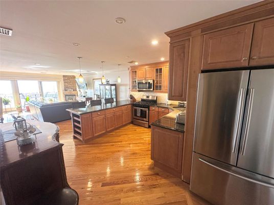 Dining room, Interior, Kitchen, Pendant Lights, Recessed Lighting, Stainless Steel Appliances, Wood Texture Flooring