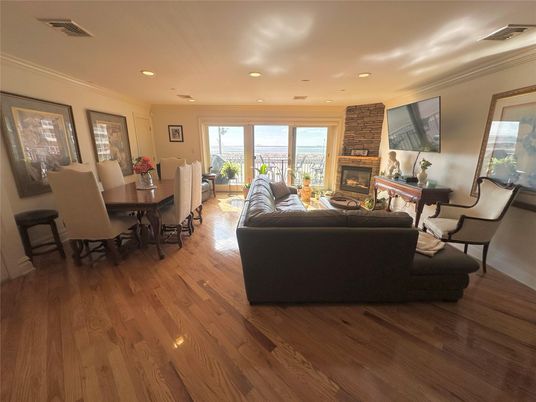 Dining room, Fireplace, Interior, Living room, Recessed Lighting, Wood Texture Flooring