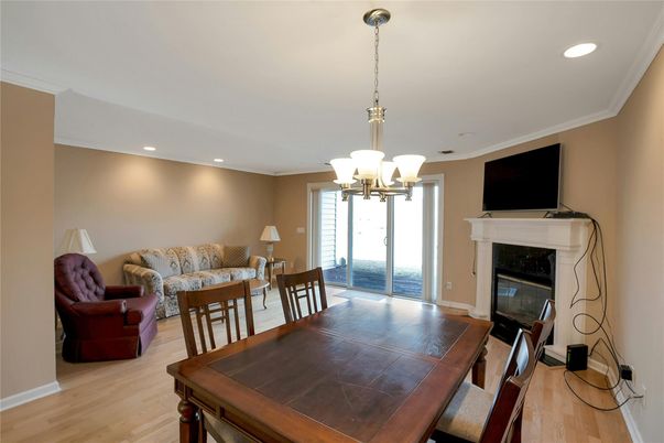 Chandelier, Dining room, Fireplace, Interior, Living room, Recessed Lighting, Water, Wood Texture Flooring