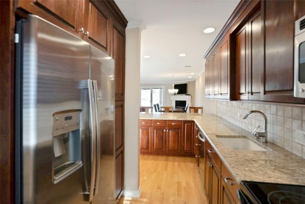 Dining room, Interior, Kitchen, Pendant Lights, Recessed Lighting, Stainless Steel Appliances, Wood Texture Flooring