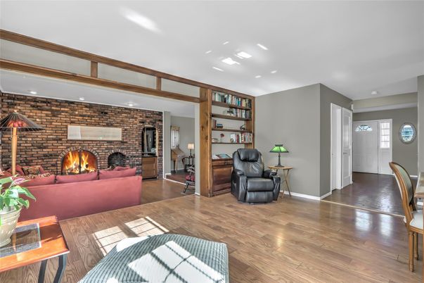 Fireplace, Interior, Living room, Recessed Lighting, Stone Walls, Wood Texture Flooring