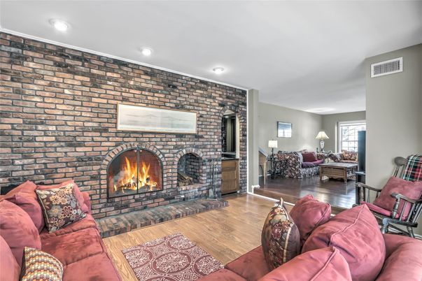 Fireplace, Interior, Living room, Recessed Lighting, Stone Walls, Wood Texture Flooring