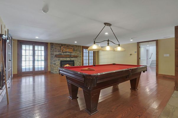 Billiard Table, Fireplace, Game Room, Interior, Pendant Lights, Recessed Lighting, Stone Walls, Wood Texture Flooring