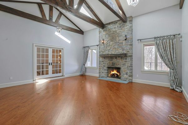 Empty room, Fireplace, Interior, Pendant Lights, Stone Walls, Wooden Beams, Wood Texture Flooring
