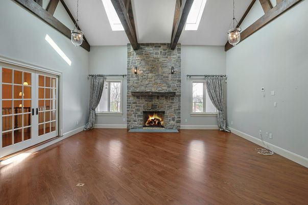 Empty room, Fireplace, Interior, Pendant Lights, Stone Walls, Wooden Beams, Wood Texture Flooring