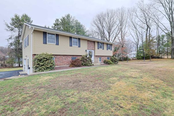 Attached, Backyard, Exterior, Facade, Brick Facade, Raised Ranch