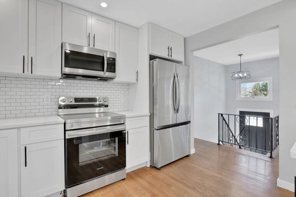 Interior, Kitchen, Pendant Lights, Recessed Lighting, Stainless Steel Appliances, Wood Texture Flooring