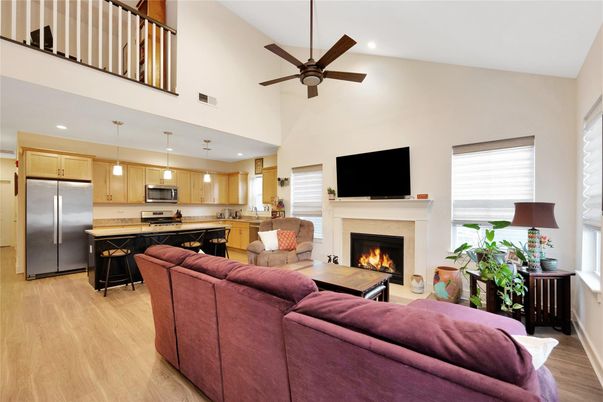 Fireplace, Interior, Kitchen, Living room, Pendant Lights, Recessed Lighting, Stainless Steel Appliances, Wood Texture Flooring
