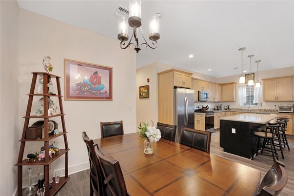 Chandelier, Dining room, Interior, Kitchen, Pendant Lights, Recessed Lighting, Stainless Steel Appliances, Wood Texture Flooring