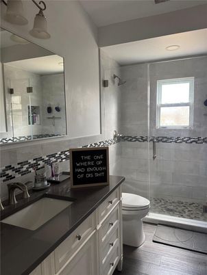 Bathroom, Dual Sink Vanities, Glass Shower, Interior, Wood Texture Flooring