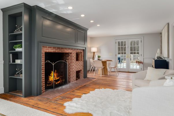 Dining room, Fireplace, Interior, Living room, Recessed Lighting, Stone Walls, Wood Texture Flooring