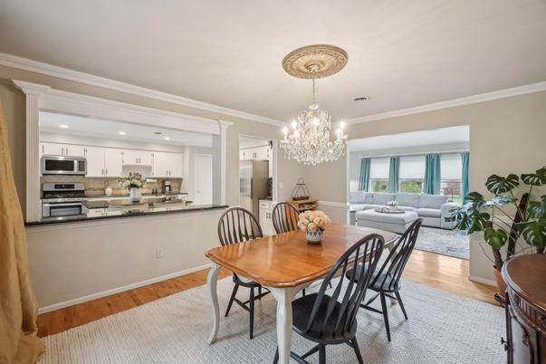 Chandelier, Dining room, Interior, Kitchen, Living room, Recessed Lighting, Stainless Steel Appliances, Wood Texture Flooring