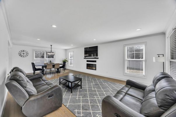 Dining room, Fireplace, Interior, Living room, Recessed Lighting, Wood Texture Flooring