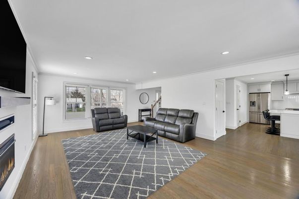 Fireplace, Interior, Kitchen, Living room, Pendant Lights, Recessed Lighting, Stainless Steel Appliances, Wood Texture Flooring