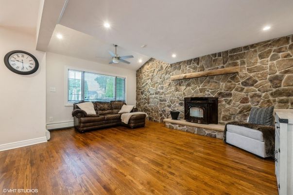 Fireplace, Interior, Recessed Lighting, Stone Walls, Wood Texture Flooring