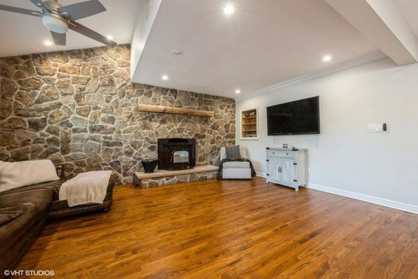 Fireplace, Interior, Recessed Lighting, Stone Walls, Wood Texture Flooring