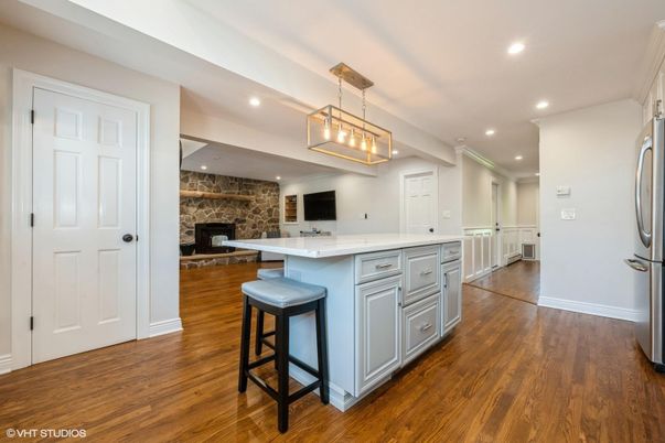 Fireplace, Interior, Kitchen, Pendant Lights, Recessed Lighting, Stone Walls, Wood Texture Flooring