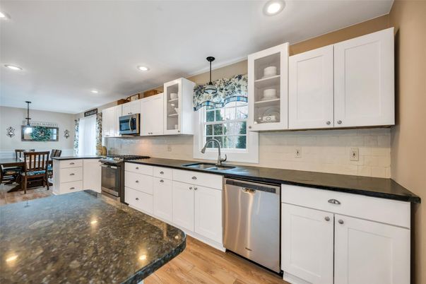 Dining room, Interior, Kitchen, Pendant Lights, Recessed Lighting, Stainless Steel Appliances, Wood Texture Flooring