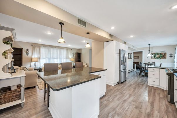 Dining room, Interior, Kitchen, Living room, Pendant Lights, Recessed Lighting, Stainless Steel Appliances, Wood Texture Flooring