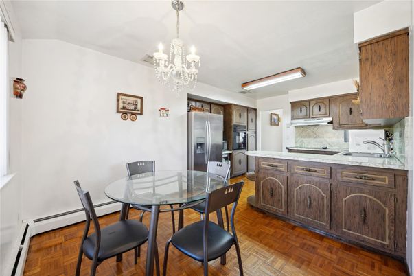 Chandelier, Dining room, Interior, Kitchen, Stainless Steel Appliances, Wood Texture Flooring