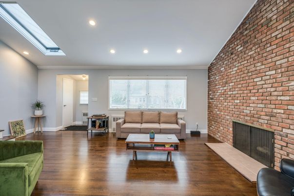 Fireplace, Interior, Living room, Recessed Lighting, Stone Walls, Wood Texture Flooring