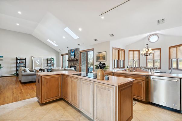 Chandelier, Dining room, Fireplace, Interior, Kitchen, Living room, Recessed Lighting, Wood Texture Flooring