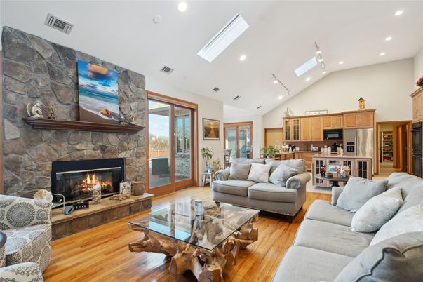 Fireplace, Interior, Kitchen, Living room, Recessed Lighting, Stone Walls, Wood Texture Flooring