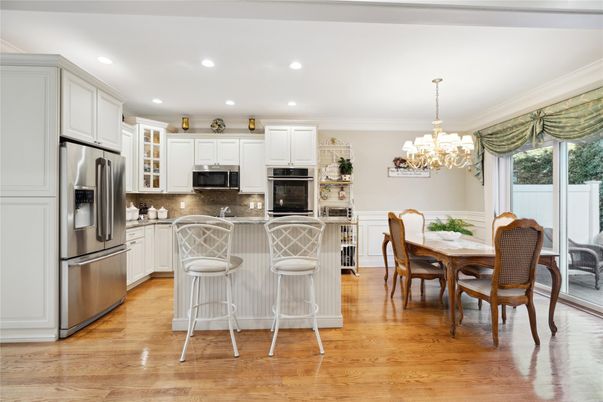 Chandelier, Dining room, Interior, Kitchen, Recessed Lighting, Stainless Steel Appliances, Wood Texture Flooring