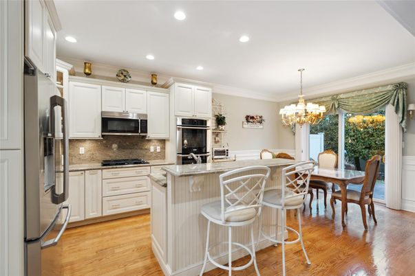 Chandelier, Dining room, Interior, Kitchen, Recessed Lighting, Stainless Steel Appliances, Wood Texture Flooring