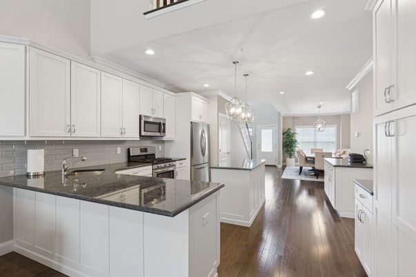 Chandelier, Dining room, Interior, Kitchen, Pendant Lights, Recessed Lighting, Stainless Steel Appliances, Wood Texture Flooring