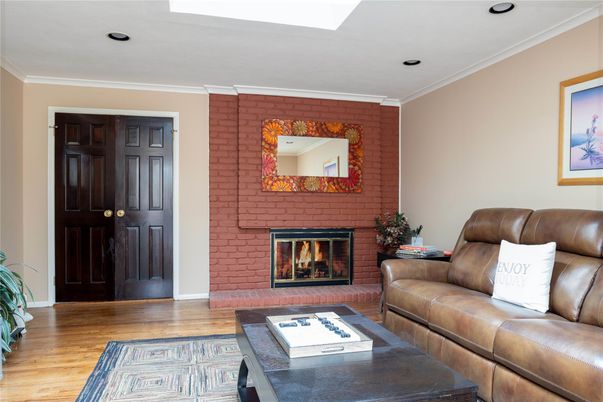 Fireplace, Interior, Living room, Recessed Lighting, Stone Walls, Wood Texture Flooring