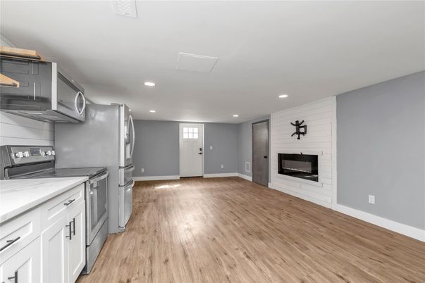 Fireplace, Interior, Kitchen, Recessed Lighting, Wood Texture Flooring