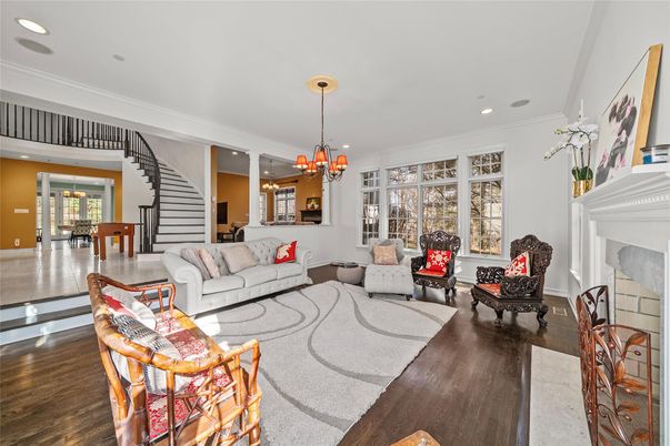Chandelier, Dining room, Fireplace, Interior, Living room, Pendant Lights, Recessed Lighting, Wood Texture Flooring