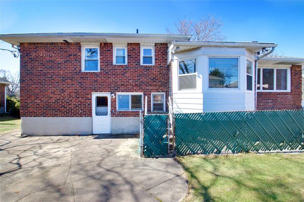 Exterior, Facade, Brick Facade, Raised Ranch