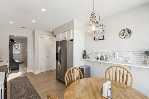 Dining room, Interior, Kitchen, Pendant Lights, Recessed Lighting, Stainless Steel Appliances, Wood Texture Flooring