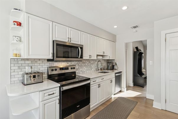 Interior, Kitchen, Recessed Lighting, Stainless Steel Appliances, Wood Texture Flooring