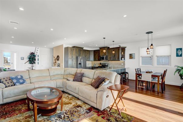 Dining room, Interior, Kitchen, Living room, Pendant Lights, Recessed Lighting, Stainless Steel Appliances, Wood Texture Flooring