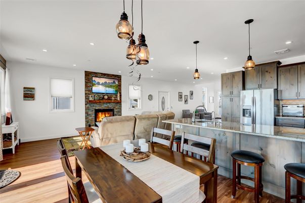Dining room, Fireplace, Interior, Kitchen, Living room, Pendant Lights, Recessed Lighting, Stainless Steel Appliances, Wood Texture Flooring