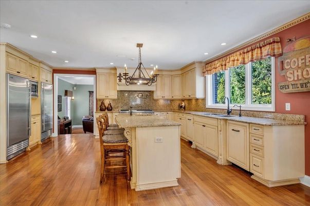 Chandelier, Interior, Kitchen, Pendant Lights, Recessed Lighting, Stainless Steel Appliances, Wood Texture Flooring