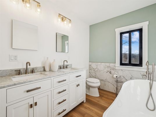 Bathroom, Dual Sink Vanities, Free Standing Baths, Interior, Marble Walls, Wood Texture Flooring
