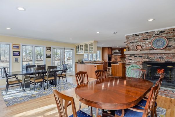 Dining room, Fireplace, Interior, Kitchen, Recessed Lighting, Stone Walls, Wood Texture Flooring