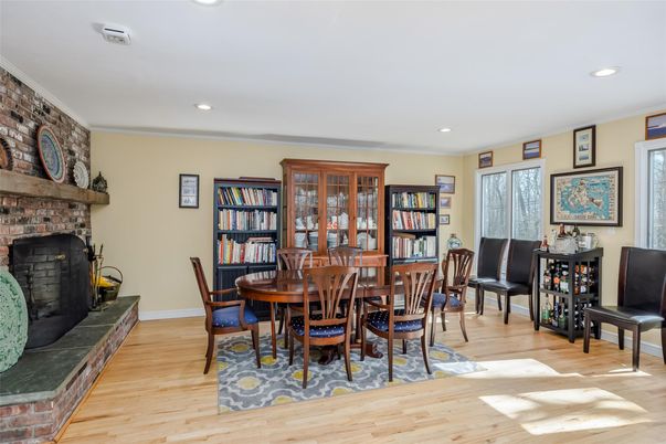 Dining room, Fireplace, Interior, Recessed Lighting, Stone Walls, Wood Texture Flooring
