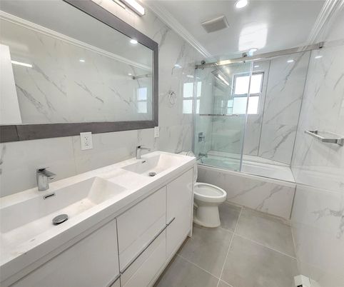 Bathroom, Dual Sink Vanities, Glass Shower, Interior, Marble Walls, Recessed Lighting