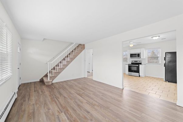 Empty room, Interior, Kitchen, Stainless Steel Appliances, Wood Texture Flooring