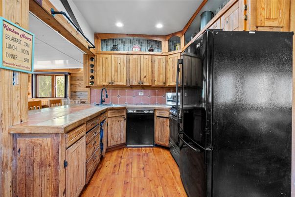 Interior, Kitchen, Recessed Lighting, Tile Countertops, Wood Texture Flooring