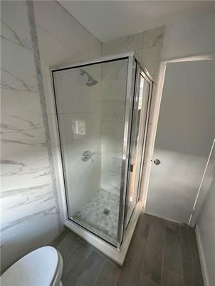 Bathroom, Glass Shower, Interior, Marble Walls, Wood Texture Flooring