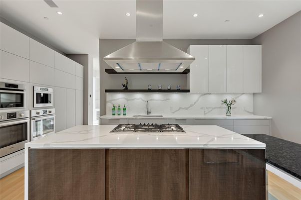 Interior, Kitchen, Marble Walls, Recessed Lighting, Stainless Steel Appliances, Wood Texture Flooring
