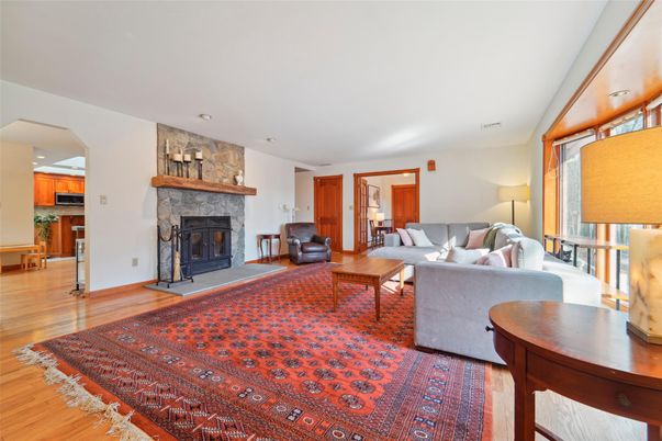 Fireplace, Interior, Living room, Recessed Lighting, Stone Walls, Wood Texture Flooring