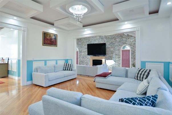 Chandelier, Fireplace, Interior, Living room, Recessed Lighting, Stone Walls, Wood Texture Flooring